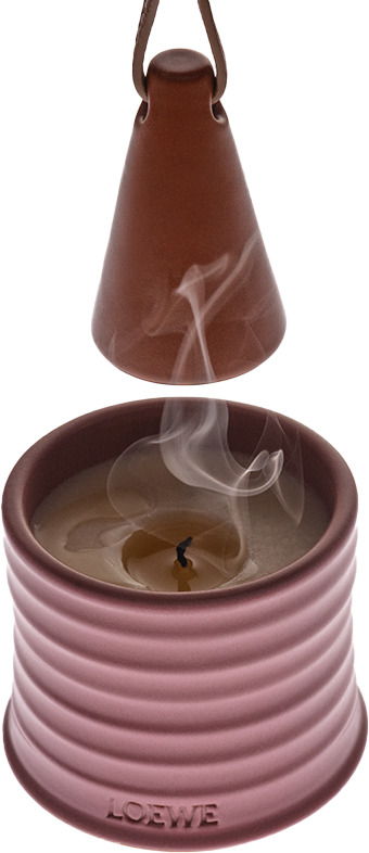 Vela rosa con humo